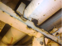 example of corrosion visible at a simple pipe support